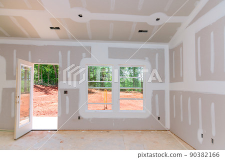 Finishing plastering drywall in ready for paint with new house Finishing plastering drywall in ready for paint with new house 90382166