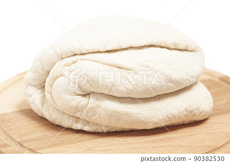 Fresh yeast dough on cutting board Fresh yeast dough on cutting board 90382530