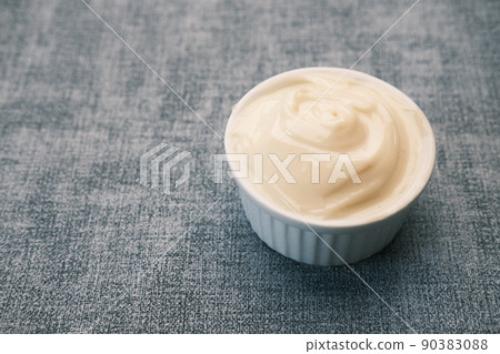 close up of Mayonnaise in container on table . close up of Mayonnaise in container on table . 90383088
