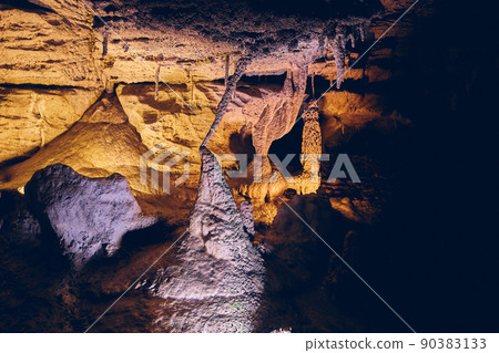 Cave formations unusual stalagmites and stalactites meeting together 90383133
