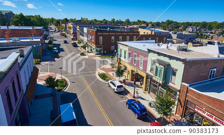 Shops along street of suburban town 90383173