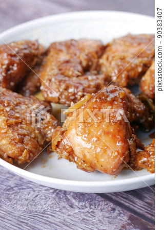 slice of a BBQ chicken from a plate  90383407