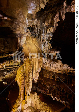 Vertical rock formations in cave large stalactites Vertical rock formations in cave large stalactites 90383529