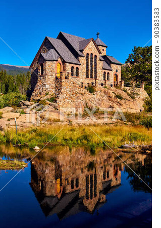 Vertical of pond with church building reflection in desert 90383583