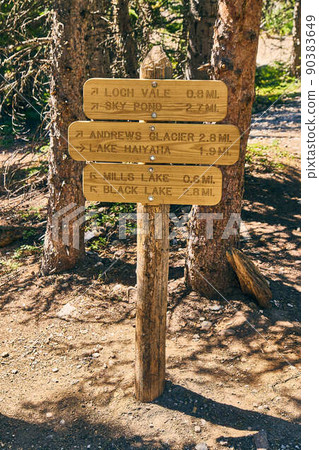 Hiking trail trailhead sign to lakes in mountains Hiking trail trailhead sign to lakes in mountains 90383649
