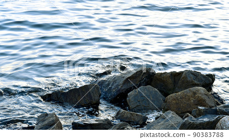 Sea surf with stone, Peaceful background 90383788