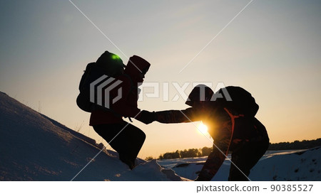 teamwork silhouette. handshake comrades rejoicing victory. shake hands command group mountain hill sunset. overcome difficulties. top cliff goal climbers. trekking snowy winter hike happy successful. teamwork silhouette. handshake comrades rejoicing victory. shake hands command group mountain hill sunset. overcome difficulties. top cliff goal climbers. trekking snowy winter hike happy successful. 90385527
