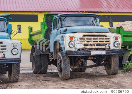 Freight trucks stand by the market storage. Freight trucks stand by the market storage. 90386790