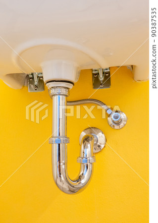 Drain pipe or sewer under sink. stainless steel pipe Drain pipe or sewer under sink. stainless steel pipe 90387535