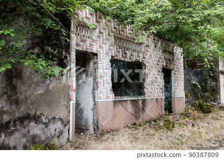 Remains of the destroyed houses of the Armero Town covered by trees and nature after 37 years of the tragedy caused by the Nevado del Ruiz Volcano in 1985 90387809