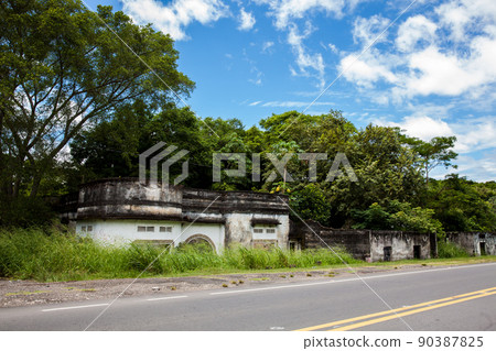 Remains of the destroyed houses of the Armero Town covered by trees and nature after 37 years of the tragedy caused by the Nevado del Ruiz Volcano in 1985 90387825
