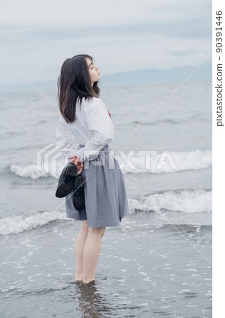 Schoolgirl on the beach 90391446