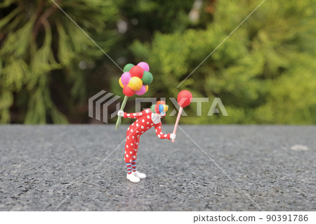 a fun of figure colorful clown with balloons 90391786
