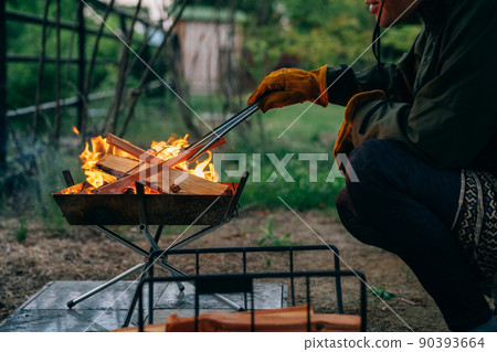 A man bonfire in a summer camp (no face) 90393664