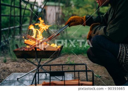 A man bonfire in a summer camp (no face) A man bonfire in a summer camp (no face) 90393665
