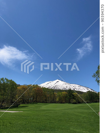 Spring Hokkaido Golf course overlooking Niseko Annupuri with residual snow Spring Hokkaido Golf course overlooking Niseko Annupuri with residual snow 90394370