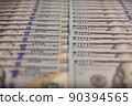 A lot of hundred-dollar bills in close-up. Background of hundred-dollar bills. 90394565