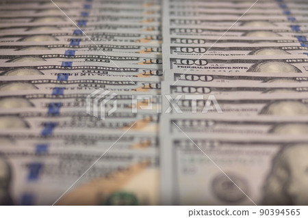 A lot of hundred-dollar bills in close-up. Background of hundred-dollar bills. 90394565