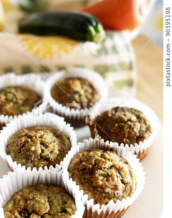 Handmade zucchini muffins and zucchini Handmade zucchini muffins and zucchini 90395198
