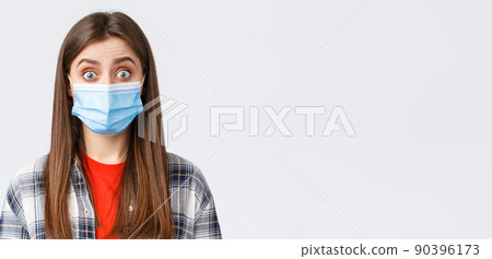 Coronavirus outbreak, leisure on quarantine, social distancing and emotions concept. Close-up of intrigued, surprised woman hear interesting news, wear medical mask, widen eyes Coronavirus outbreak, leisure on quarantine, social distancing and emotions concept. Close-up of intrigued, surprised woman hear interesting news, wear medical mask, widen eyes 90396173