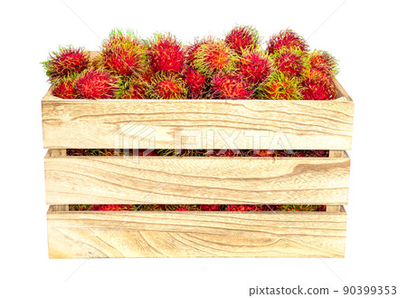 rambutan fruit in wooden crate..on a white background rambutan fruit in wooden crate..on a white background 90399353