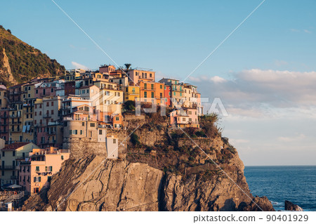 Rocky hills and colorful historic buildings of Manarola, Italy. Rocky hills and colorful historic buildings of Manarola, Italy. 90401929