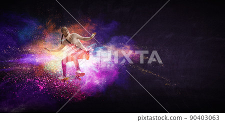 Young woman riding her skateboard Young woman riding her skateboard 90403063