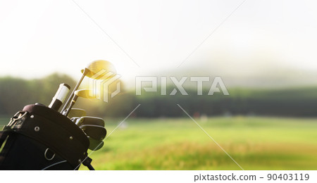 Golf clubs drivers over green field background with copy space Golf clubs drivers over green field background with copy space 90403119