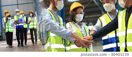 Team of business people, worker  Foreman, engineer wear face masks to prevent covid-19 in shipping yard. Concept of transportation, logistics. Selective focused 90403239