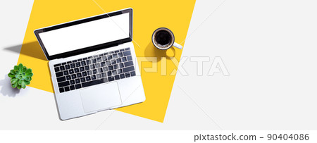 Laptop computer with a coffee cup Laptop computer with a coffee cup 90404086