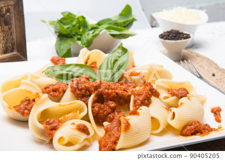 shell type pasta dish with meat served on table shell type pasta dish with meat served on table 90405205