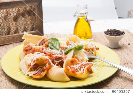 shell type pasta dish with meat served on table shell type pasta dish with meat served on table 90405207