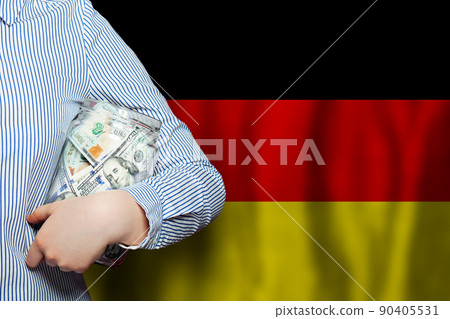 Dollars banknote and German flag background. Business, politics, banking and finance concept Dollars banknote and German flag background. Business, politics, banking and finance concept 90405531