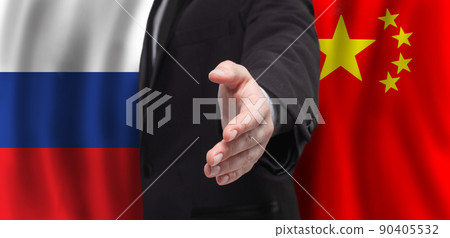 Russia and China concept. Male open hands for handshake on Russian and Chinese flag background Russia and China concept. Male open hands for handshake on Russian and Chinese flag background 90405532