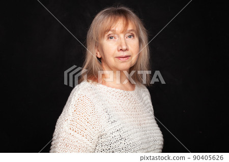 Beautiful senior woman looking at camera. Closeup face of mature woman with wrinkles Beautiful senior woman looking at camera. Closeup face of mature woman with wrinkles 90405626