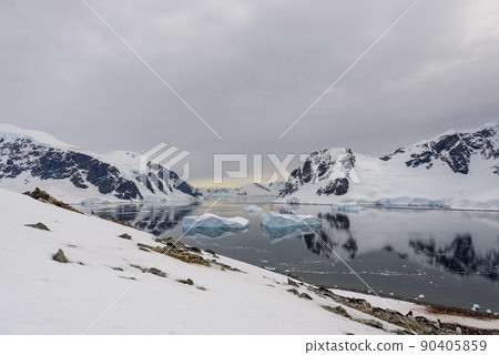 Antarctic landscape with icebergs and reflection Antarctic landscape with icebergs and reflection 90405859