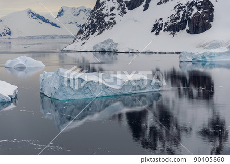 Antarctic landscape with icebergs and reflection Antarctic landscape with icebergs and reflection 90405860
