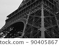 Black-and-white photo of the waist of the Eiffel Tower 90405867