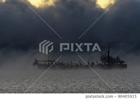 Vessel restricted in her ability to manoeuvre under way using engine at night time. Vessel engaged in dredging. Dredger working at sea. Collision regulations. 90405915