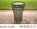 Public trash can in a park in Paris 90406313