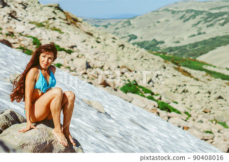 beautiful girl in a swimsuit in the mountains beautiful girl in a swimsuit in the mountains 90408016