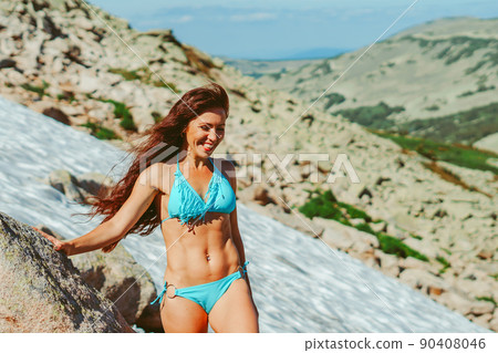 beautiful girl in a swimsuit in the mountains beautiful girl in a swimsuit in the mountains 90408046