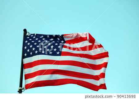 USA flag streaming in wind 90413698