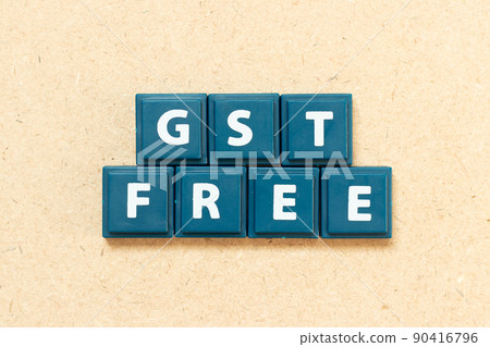 Tile alphabet letter in word GST (Abbreviation of Goods and Services Tax) free on wood background Tile alphabet letter in word GST (Abbreviation of Goods and Services Tax) free on wood background 90416796