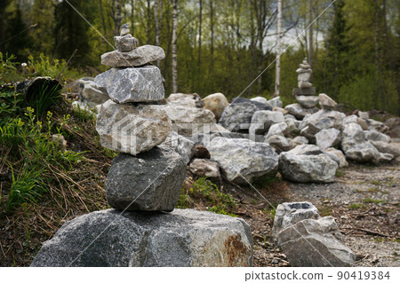 Pyramid made of stones in a former marble quarry 90419384