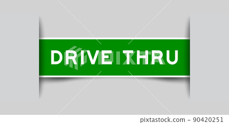 Inserted green color label sticker with word drive thru on gray background 90420251