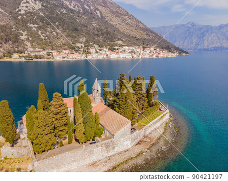 Aerophotography. View from flying drone. St George Island in the Bay of Kotor at Perast in Montenegro, with St George Benedictine Monastery. St. George Island, is a small natural island off the coast 90421197