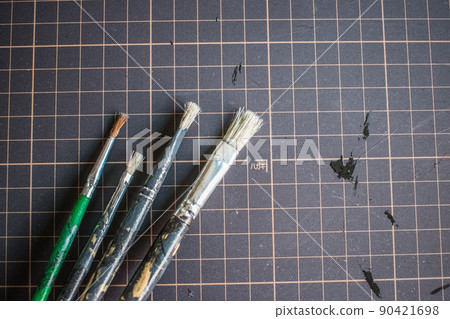 Brush placed on a work mat Brush placed on a work mat 90421698