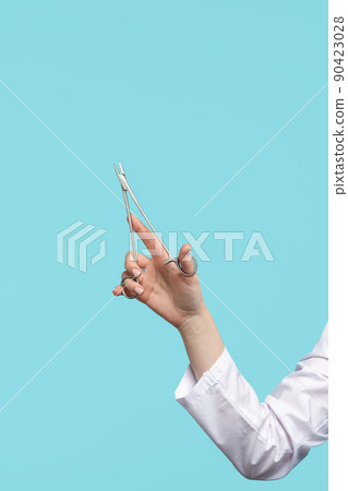 Surgical instrument in doctor hand 90423028