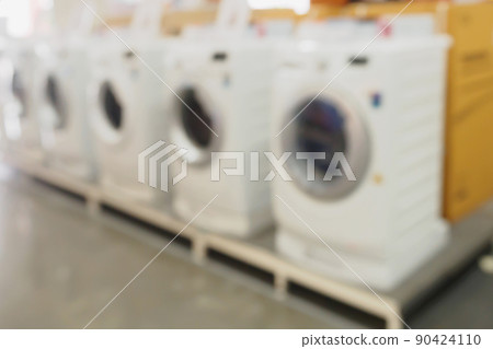 blur washing machines in electronic department store for background 90424110